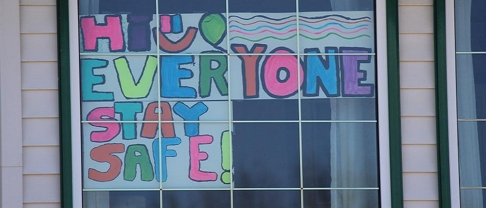 People are posting messages of support in the windows of their homes.