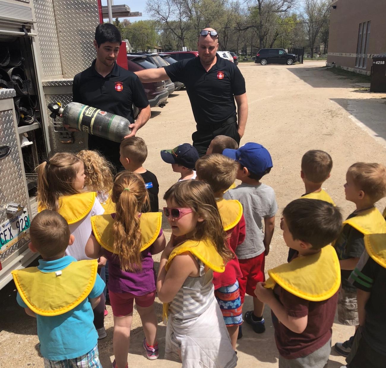Firefighters give Niverville preschoolers a tour of the town’s fire engine.