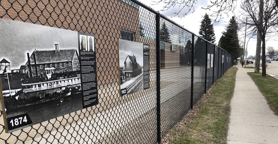 The historic storyboards on display on the fence at the Niverville Elementary School
