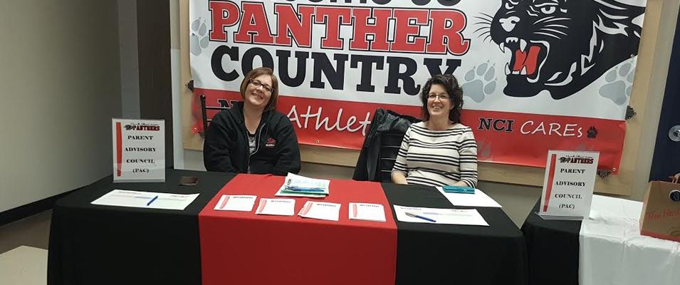 Leslie Bardal (left) and Heather Miller (right) at a PAC kiosk.