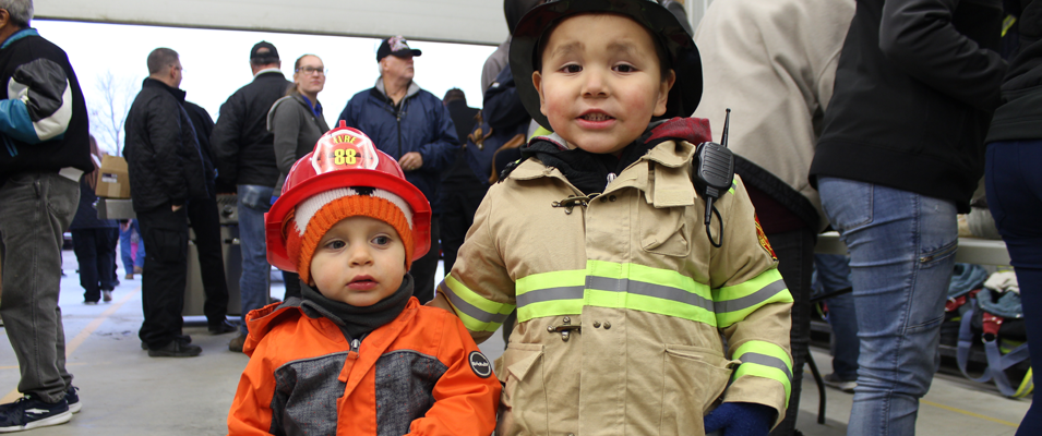 Brody Smith and Lucas Giesbrecht in firefighter gear.
