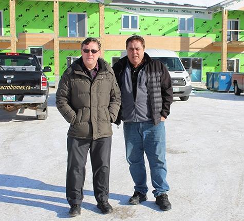 Dr. Phillip Hughes and Arthur Adam outside the new IDC Professional Centre