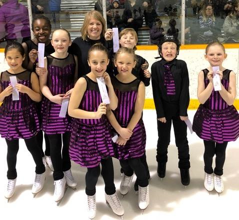 Niverville Skating Club’s synchro team, Aurora Ice, with their silver ribbons.