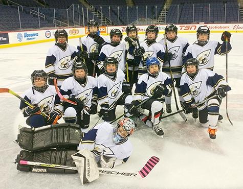 The Atom A Clippers at centre ice at Bell MTS Place