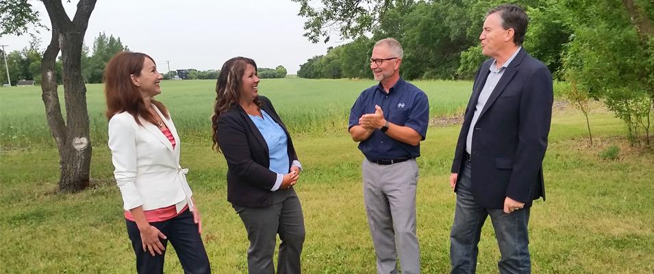 HSD trustees Ruby Wiens and Shannon Friesen with Superintendent Randy Dueck and Niverville mayor Myron Dyck at the site of the future school