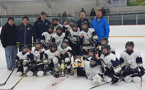 The Clippers Atom A team celebrates their victory