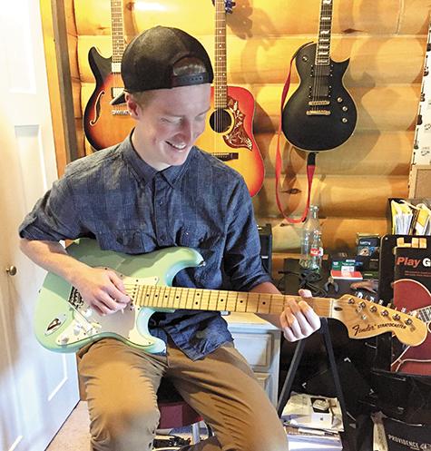 Justin Braun will be offering guitar lessons for a charitable cause