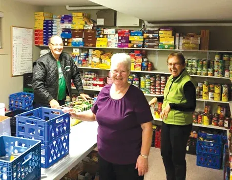 Helping Hands volunteers, Dale Toms, Mary Toms, and Irene Adams