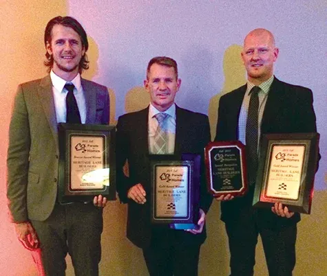 Marshall Douglas, Doug Dyck, and Justin Dyck accept their awards