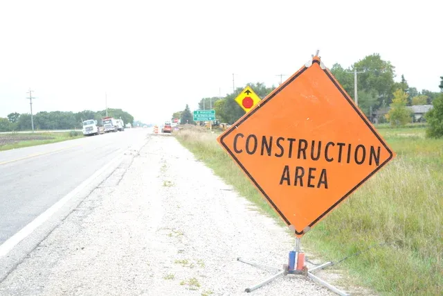 Construction crews begin installing signal bases