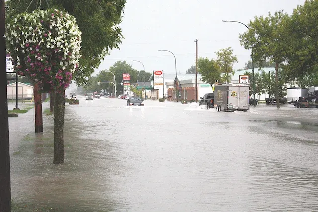A flash flood on August 29, 2015 covers Main Street from curb to curb