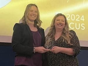 Chantel Todd receives her award from Courtney Bangert-Murray, president of Recreation Manitoba.