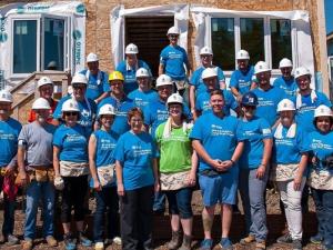 RRG team members along with volunteers at a Habitat home build.