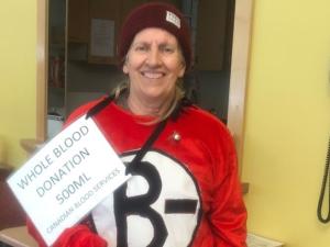 Holly Rafferty makes her one hundredth blood donation at Canadian Blood Services.