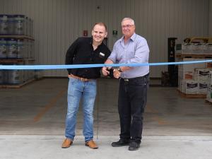 Mayor Chris Ewen cuts the ribbon with Terraco manager Marc Davy.