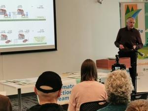 Curt Hull, Ed Lohrenz, and Molly McCracken speak at a Manitoba Climate Action event.