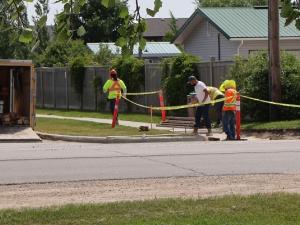Sidewalk work is underway along Fifth Avenue in preparation for the installation of new crosswalks.