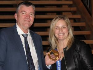 Niverville Mayor Myron Dyck alongside Jennifer Jones and her gold medal from Sochi 2014.