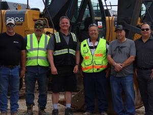 Ritchot councillors, Baudry brothers, and Ritchie Bros. employees at the Ste. Agathe site.
