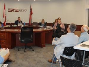 A public hearing is held for the community to respond to the proposed new Macdonald-Ritchot development plan.