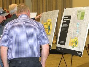 Residents look over plans for new development in Île-des-Chênes.
