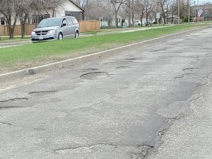 Potholes are especially bad on St. Adolphe's Main Street this summer. Patches are on the way.