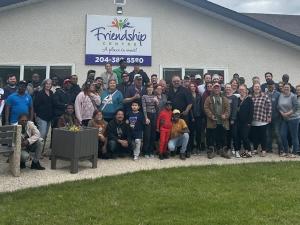 The Niverville fair committee gathers with the Wonder Shows crew on the Wednesday before the fair.