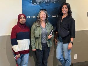 A staff member of the Salvation Army Winnipeg Centre of Hope gives a tour to Leona Doerksen (middle) and Lisa Clark of Lisa Clark Designs (right).