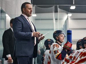 Nighthawks head coach Dwight Hirst behind the bench.