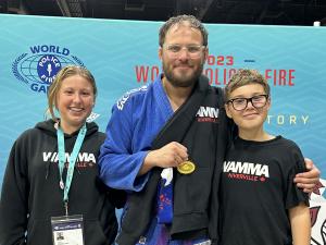 Jens Reuter with his kids at the World Police and Fire Games in 2023, where he won gold in his division in jiujitsu.