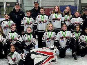 The Red River Rage U12 team with their silver medals.