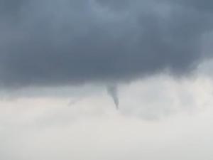 A funnel cloud forms over Niverville.