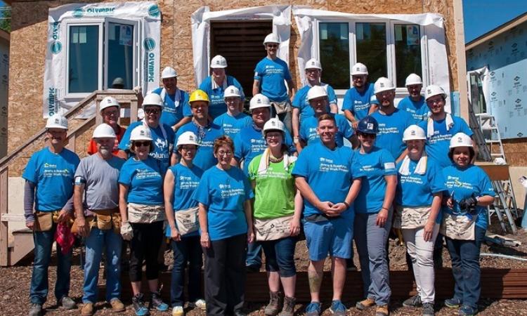 RRG team members along with volunteers at a Habitat home build.