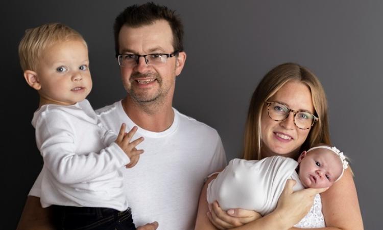 Joel and Raesha Enns with their two children.