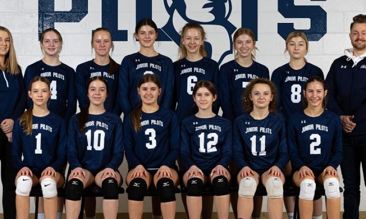 The Junior Pilots 15U Navy girls volleyball team.