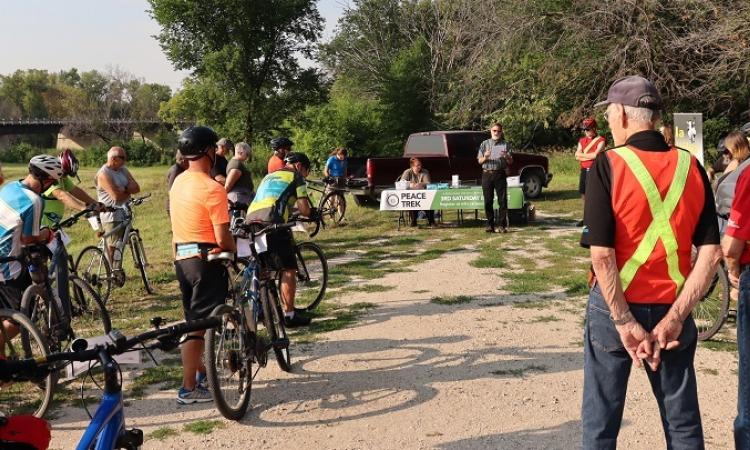 Historian Ernie Braun reads blessing at Peace Trek kickoff.
