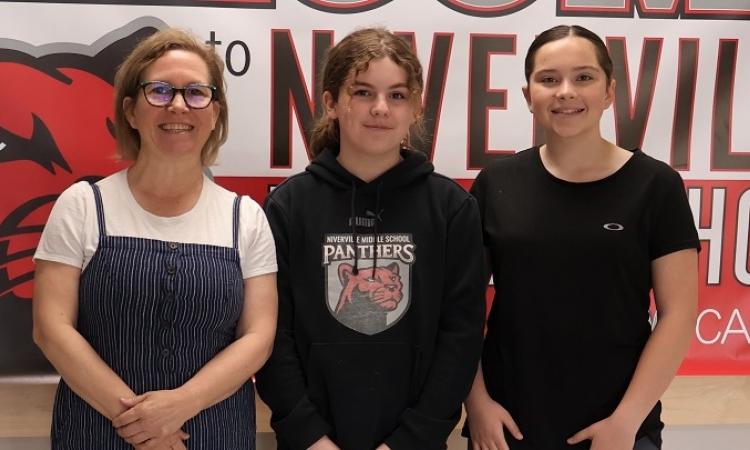 Ms. Van den Brul with students Kyra Bird and Ana Dean.