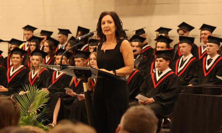 NHS Principal Kimberley Funk addresses this year's graduates.