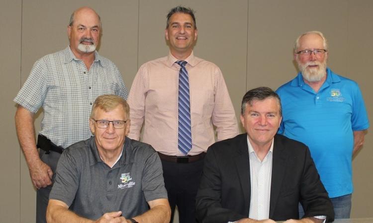 Back row: Councillors Kevin Stott, Nathan Dueck, and Chris Wiebe. Front row: Deputy Mayor John Funk and Mayor Myron Dyck.