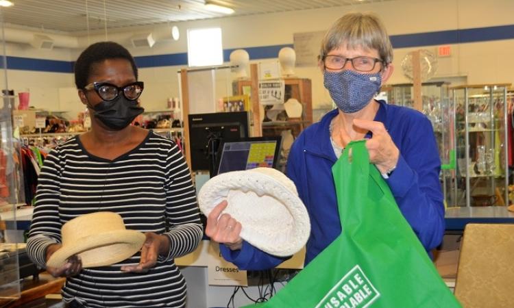 Niverville MCC Thrift Shop volunteer Olasunkanmi Dickson-Isu and day manager Debbie Sandland are hard at work on a Thursday morning.