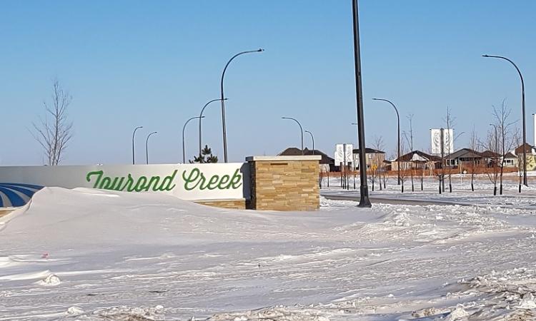 The entrance to the Tourond Creek development in St. Adolphe.