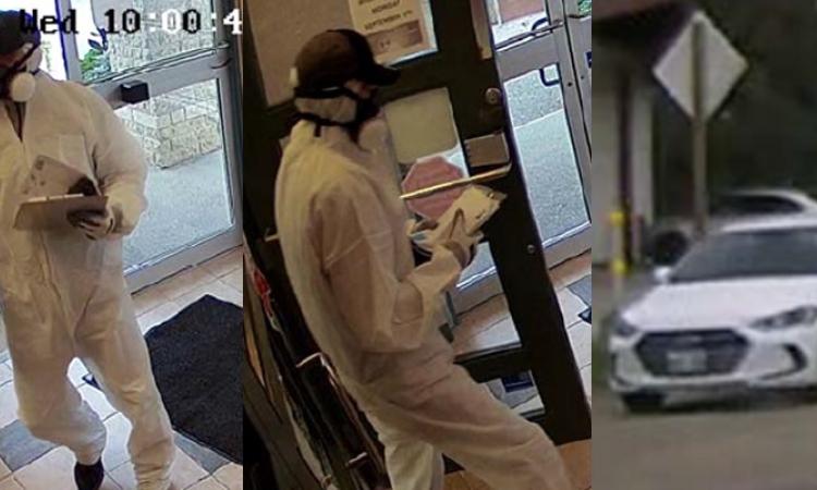 A suspect enters, robs, and leaves the Niverville Credit Union branch in Landmark.