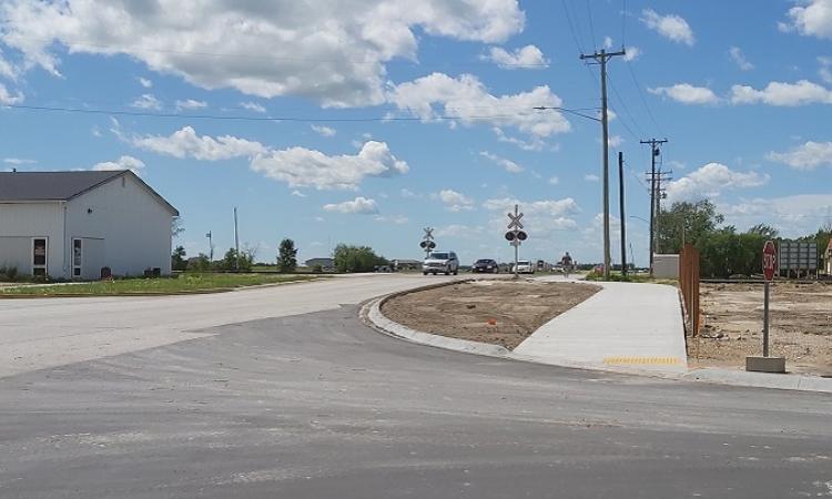 The new sidewalks on the north side of Main Street through the railway crossing.