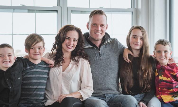 Colleen and Grant Dyck alongside their four children, Moses, Leo, Oskar, and Georgia.