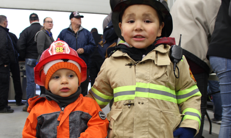 Brody Smith and Lucas Giesbrecht in firefighter gear.