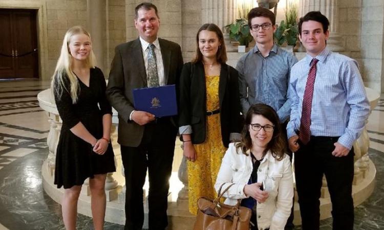 Leah Reimer, Shannon Martin, Maddie Thompson, Marcus Jofre, and Corey Golden. Floor: Suzanne Mathieu, the students' teacher