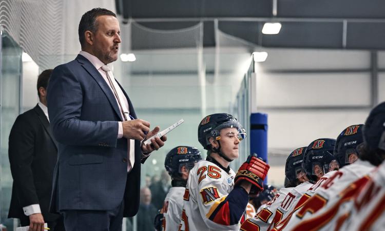 Nighthawks head coach Dwight Hirst behind the bench.
