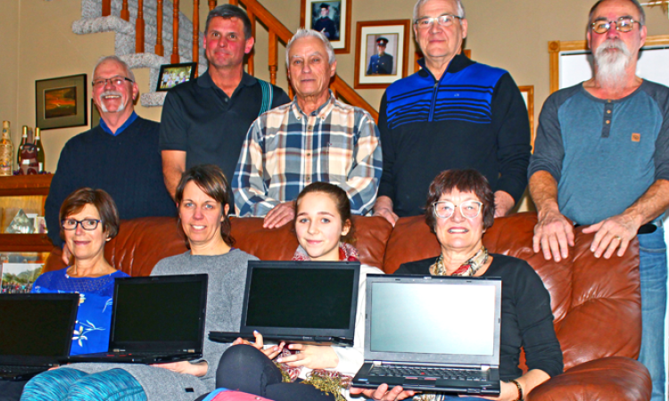 Members of Red River Mission prepare for their 2018 trip to Peru, with laptop gifts for the orphans living there