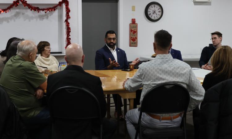 Obby Khan meets with supporters in Niverville.