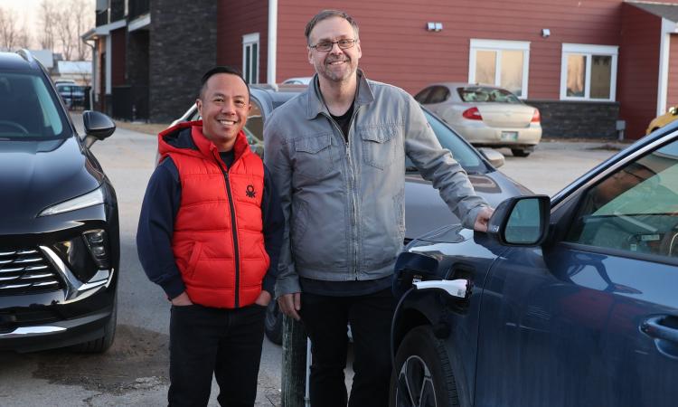 Joey Villanueva and Evan Braun charge their plug-in hybrid.